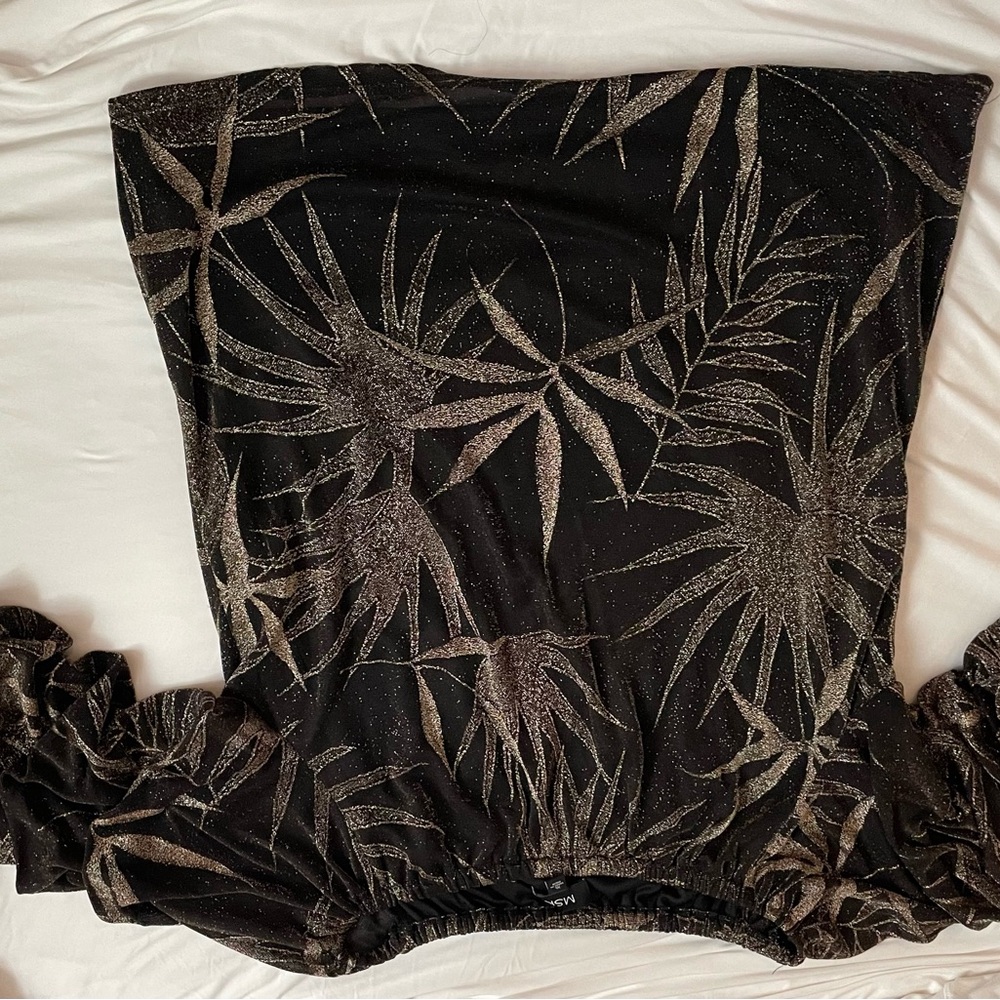Black and Gold. Body lined with sheer sleeves